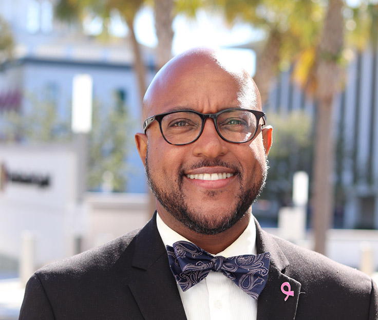 portrait of a man in a suit and glasses