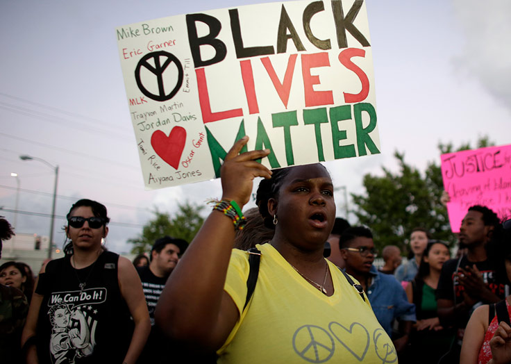 a group protesting with signs