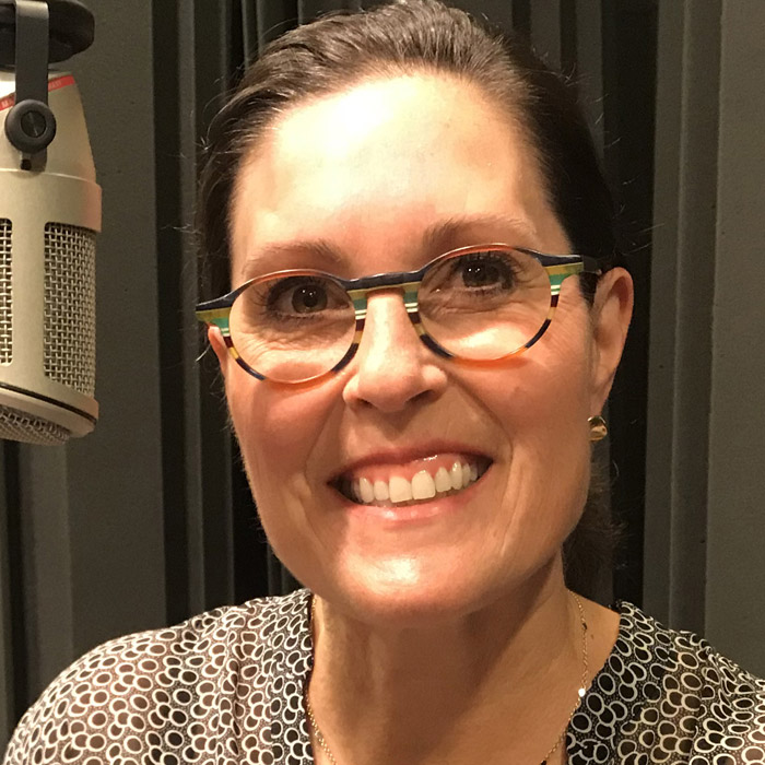 headshot of amanda at the microphone in wfsu's studio